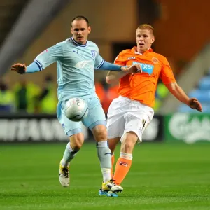 David Bell vs Keith Southern: Intense Battle for Control in Coventry City vs Blackpool Championship Clash (September 27, 2011, Ricoh Arena)