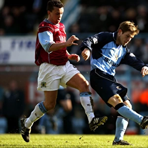 Determined Duel: Gudjohnsson's Defiant Shot vs. Weller's Pressure (Coventry City vs Burnley, Nationwide League Division One, 13-03-2004)