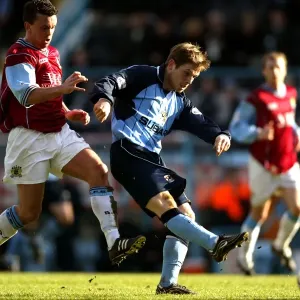 Determined Duel: Gudjohnsson's Defiant Shot vs. Weller's Pressure (Coventry City vs Burnley, Nationwide League Division One, 13-03-2004) Determined Duel: Gudjohnsson's Defiant Shot vs. Weller's Pressure (Coventry City vs Burnley, Nationwide League Division One, 13-03-2004)