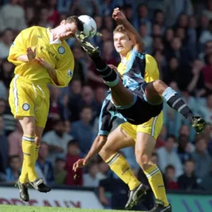 Dion Dublin's Epic Leap Print: 90s Football Action Dion Dublin's Epic Leap Print: 90s Football Action