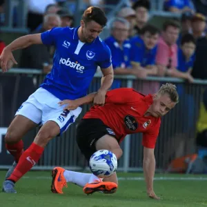 Enda Stevens vs George Thomas: A Battle for Possession in Portsmouth vs Coventry City Pre-Season Friendly Enda Stevens vs George Thomas: A Battle for Possession in Portsmouth vs Coventry City Pre-Season Friendly