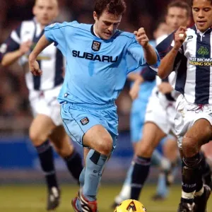 A Fierce Face-Off: David Thompson vs. West Bromwich Albion - Coventry City's Intense Division One Clash (December 12, 2001) A Fierce Face-Off: David Thompson vs. West Bromwich Albion - Coventry City's Intense Division One Clash (December 12, 2001)