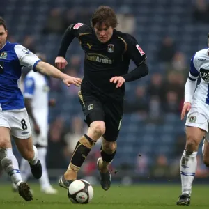 Fifth Round FA Cup Clash: Aron Gunnarsson of Coventry City vs. Blackburn Rovers David Dunn and Stephen Warnock (2009) Fifth Round FA Cup Clash: Aron Gunnarsson of Coventry City vs. Blackburn Rovers David Dunn and Stephen Warnock (2009)