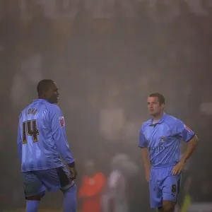 Foggy Face-off: Stern John and Michael Doyle Before the Kick-off (Coventry City vs Stoke City, 2006) Foggy Face-off: Stern John and Michael Doyle Before the Kick-off (Coventry City vs Stoke City, 2006)