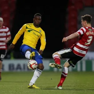 Franck Moussa Outmuscles James Husband: Coventry City's Edge over Doncaster Rovers in npower Football League One Franck Moussa Outmuscles James Husband: Coventry City's Edge over Doncaster Rovers in npower Football League One