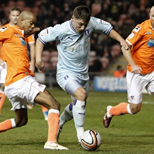 Gary Deegan Dodges Ludovic Sylvestre: Tight Chase in Coventry City vs Blackpool (31-01-2012)