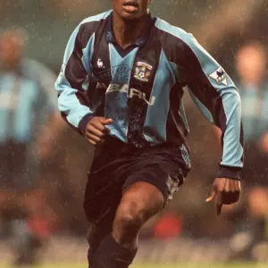 George Boateng Stands Firm Against Manchester United: A Tense Moment in Coventry City's FA Carling Premiership (December 1997) George Boateng Stands Firm Against Manchester United: A Tense Moment in Coventry City's FA Carling Premiership (December 1997)