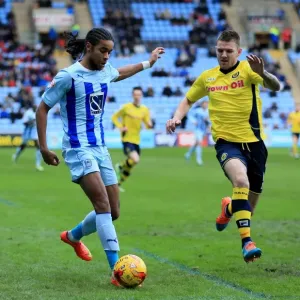 Intense Battle for Possession: Dominic Samuel vs Ashley Eastham in Coventry City vs Rochdale (Sky Bet League One) Intense Battle for Possession: Dominic Samuel vs Ashley Eastham in Coventry City vs Rochdale (Sky Bet League One)