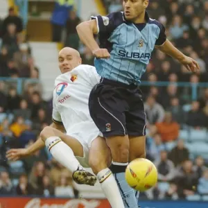 Intense Midfield Battle: Youssef Safri vs. Gavin Mahon (Coventry City vs. Watford, Nationwide Division One, 10-01-2004) Intense Midfield Battle: Youssef Safri vs. Gavin Mahon (Coventry City vs. Watford, Nationwide Division One, 10-01-2004)