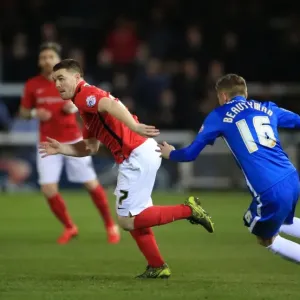 Intense Moment: John Fleck Charges Towards Harry Beautyman in Sky Bet League One Match at ABAX Stadium Intense Moment: John Fleck Charges Towards Harry Beautyman in Sky Bet League One Match at ABAX Stadium
