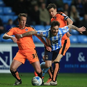 Intense Moment: Romain Vincelot of Coventry City Charges Forward Against Nicky Shorey and Owen Garvan of Colchester United at Ricoh Arena