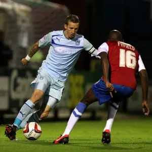 Intense Rivalry: Carl Baker vs Jamal Fyfield in the Johnstones Paint Trophy Northern Section Clash between Coventry City and York City Intense Rivalry: Carl Baker vs Jamal Fyfield in the Johnstones Paint Trophy Northern Section Clash between Coventry City and York City