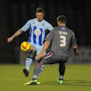 Intense Rivalry: Coventry City vs Rotherham United - A Battle for the Ball in Sky Bet League One