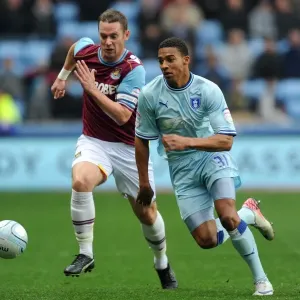 Intense Rivalry: Cyrus Christie vs. Kevin Nolan Battle for Ball (Npower Championship, Coventry City vs. West Ham United, 19-11-2011) Intense Rivalry: Cyrus Christie vs. Kevin Nolan Battle for Ball (Npower Championship, Coventry City vs. West Ham United, 19-11-2011)