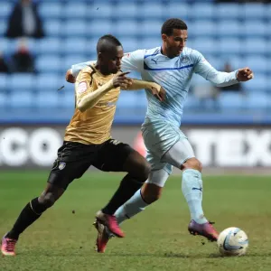 Intense Rivalry: Cyrus Christie vs. Gavin Massey's Battle for Ball Supremacy in Coventry City vs. Colchester United (Npower Football League One, Ricoh Arena, 12-3-2013) Intense Rivalry: Cyrus Christie vs. Gavin Massey's Battle for Ball Supremacy in Coventry City vs. Colchester United (Npower Football League One, Ricoh Arena, 12-3-2013)