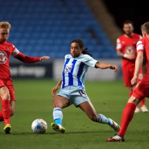 Intense Rivalry: Dominic Samuel vs. Josh Wright's Battle for Ball Supremacy in Coventry City vs. Leyton Orient (Sky Bet League One)