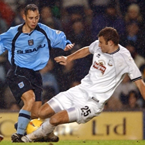 Intense Rivalry: Evatt vs. Partridge Tackle in Derby County vs. Coventry City (Nationwide League Division One, 2002)
