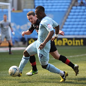 Intense Rivalry: Franck Moussa vs. Lee Hodson in Coventry City vs. Brentford Football League One Clash