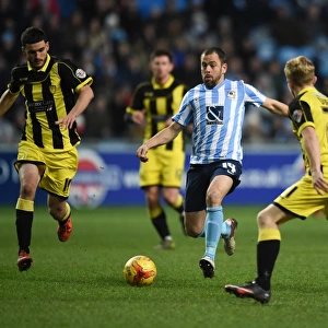 Intense Rivalry: Joe Cole Faces Off Against Burton Albion's Anthony O'Connor and Mark Duffy