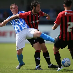 Intense Rivalry: John Fleck vs. Danny Hylton's Battle for Ball Supremacy in Coventry City's Pre-Season Clash against Oxford United Intense Rivalry: John Fleck vs. Danny Hylton's Battle for Ball Supremacy in Coventry City's Pre-Season Clash against Oxford United