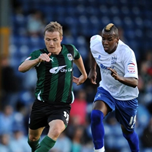 Intense Rivalry: McSheffrey vs. Mozika's Battle for Carling Cup Possession (Bury vs. Coventry City, 2011)