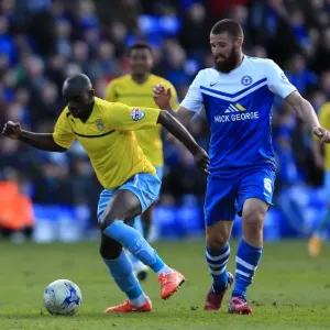 Intense Rivalry: Odelusi vs Bostwick's Battle for Ball Supremacy in Coventry City's Sky Bet League One Clash with Peterborough United