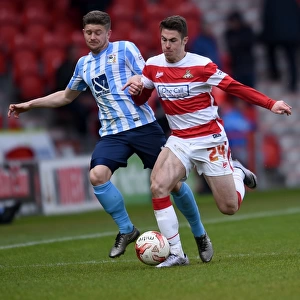 Intense Rivalry: Tommy Rowe vs. Aaron Phillips Battle in Coventry City's Sky Bet League One Clash at Doncaster Rovers (Season 2015-16)