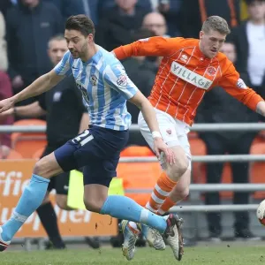 Jim McAlister vs Aaron Martin: A Battle in the Sky Bet League One Clash between Blackpool and Coventry City at Bloomfield Road Jim McAlister vs Aaron Martin: A Battle in the Sky Bet League One Clash between Blackpool and Coventry City at Bloomfield Road
