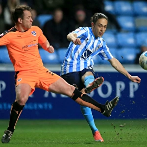 Jodi Jones of Coventry City Crossing Under Pressure from Nicky Shorey of Colchester United in Sky Bet League One Match at Ricoh Arena