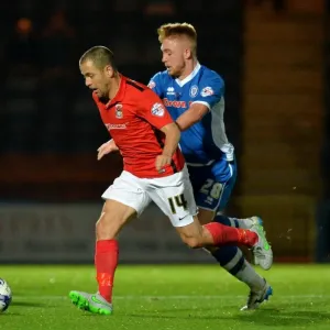 Joe Cole vs Callum Camps: A Fierce Battle for Possession in Coventry City's Sky Bet League One Clash at Rochdale's Spotland Stadium Joe Cole vs Callum Camps: A Fierce Battle for Possession in Coventry City's Sky Bet League One Clash at Rochdale's Spotland Stadium