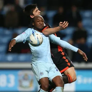 Johnstones Paint Trophy Quarter-Final: Coventry City vs Sheffield United Showdown at Ricoh Arena - Clash between Edjenguele and Maguire Johnstones Paint Trophy Quarter-Final: Coventry City vs Sheffield United Showdown at Ricoh Arena - Clash between Edjenguele and Maguire