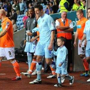 Lukas Jutkiewicz and Mascot Leading Coventry City Out at Ricoh Arena vs Blackpool (Npower Football League Championship, 27-09-2011)