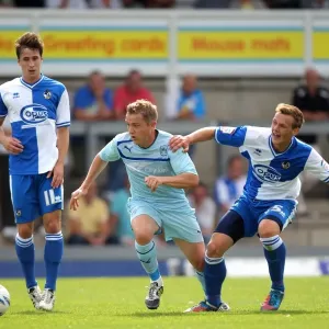 McSheffrey vs. Clucas: A Battle for the Ball in Coventry City's Pre-Season Clash with Bristol Rovers McSheffrey vs. Clucas: A Battle for the Ball in Coventry City's Pre-Season Clash with Bristol Rovers