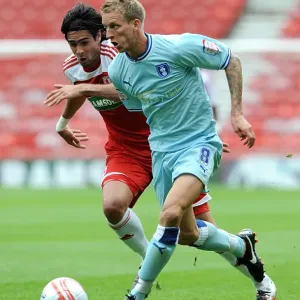 Middlesbrough vs Coventry City: Clash between Rhys Williams and Carl Baker in Championship Action Middlesbrough vs Coventry City: Clash between Rhys Williams and Carl Baker in Championship Action