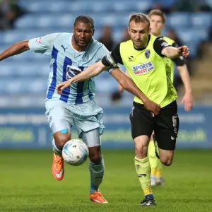 Reda Johnson vs. Liam Kelly: A Fierce Rivalry Unfolds in Coventry City's Sky Bet League One Clash against Oldham Athletic