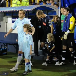 Sammy Clingan Leads Coventry City Out at The Den for Npower Championship Match against Millwall (November 1, 2011) Sammy Clingan Leads Coventry City Out at The Den for Npower Championship Match against Millwall (November 1, 2011)