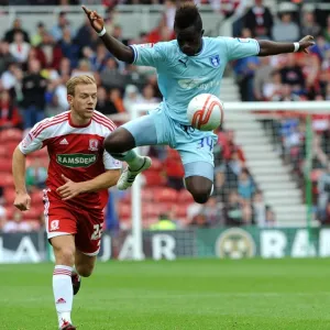 Soaring High: Gael Bigirimana's Aerial Mastery in Coventry City's Championship Battle at Middlesbrough (2011) Soaring High: Gael Bigirimana's Aerial Mastery in Coventry City's Championship Battle at Middlesbrough (2011)