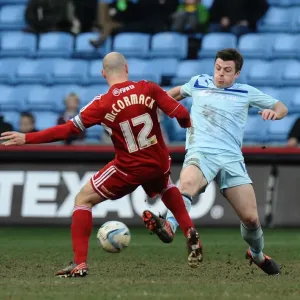 Steven Jennings vs Alan McCormack: Intense Tackle in Coventry City vs Swindon Town Npower League One Match Steven Jennings vs Alan McCormack: Intense Tackle in Coventry City vs Swindon Town Npower League One Match