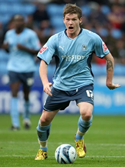 Images Dated 2009 October: Action-Packed Moment: Aron Gunnarsson vs