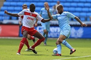 Images Dated 9th September 2012: Action-Packed Rivalry: Lucas Akins vs. David McGoldrick at Ricoh Arena (Npower Football League One)