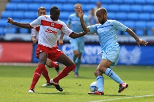 Coventry City V Stevenage : Ricoh Arena : 09-09-2012 Prints: Action-Packed Rivalry: Lucas Akins vs