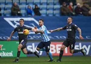 Images Dated 13th February 2016: Adam Armstrong Slips Past Bury's Defenders in Coventry City's League One Clash
