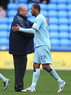 Images Dated 25th February 2012: Andy Thorn and Clive Platt: Celebrating Promotion-Clinching Goal with Ricoh Arena Crowd