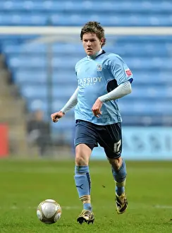 Images Dated 2010: Aron Gunnarsson in Action for Coventry City against Portsmouth in FA Cup Third Round Replay at Ricoh Arena (January 12)
