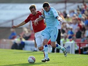 Images Dated 1st October 2011: Barnsley vs Coventry City: Intense Battle for the Ball between Scott Wiseman and Lucas Jutkiewicz