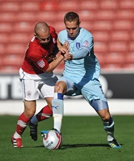 Images Dated 1st October 2011: Barnsley vs Coventry City: Intense Battle for Control in Championship Match