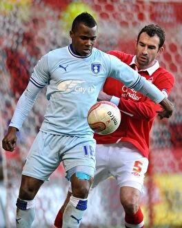 Images Dated 18th February 2012: Battle for the Ball: Alex Nimely vs. Danny Higginbotham - Coventry City vs