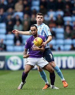 Images Dated 26th December 2015: Battle for the Ball: Chris Stokes vs. Byron Moore - Coventry City vs