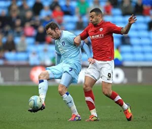 Images Dated 25th February 2012: Battle for the Ball: Coventry City vs Barnsley, Npower Championship - Keogh vs Davies (2012)