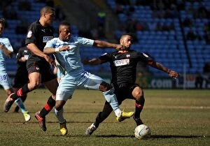 Images Dated 6th April 2013: Battle for the Ball: Coventry City vs. Brentford in Football League One at Ricoh Arena